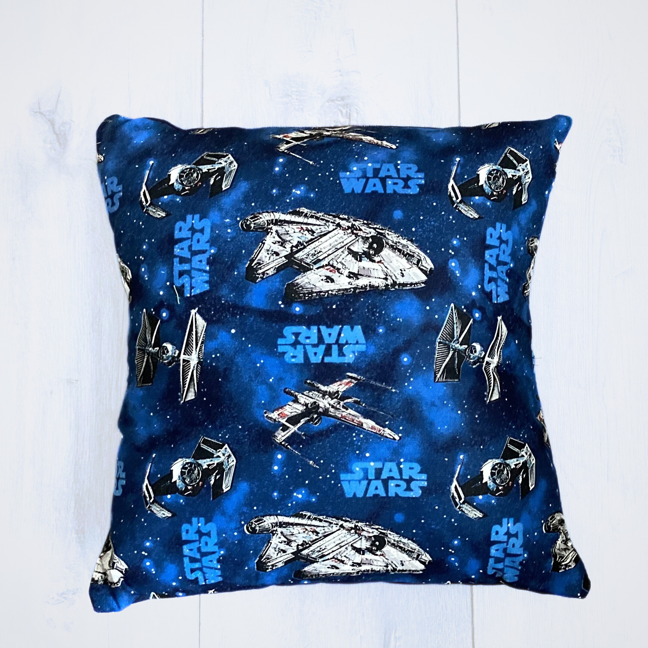 star wars blue ship pillow.png