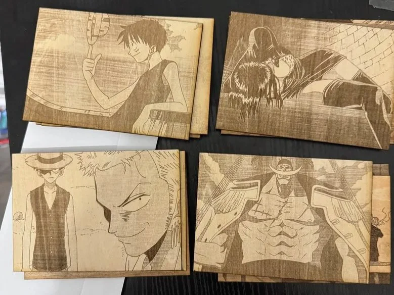 Four wood engravings featuring anime-style characters, including a boy with a tennis racket, a hooded figure with long hair, a woman with a hat, and a muscular man with a cape.