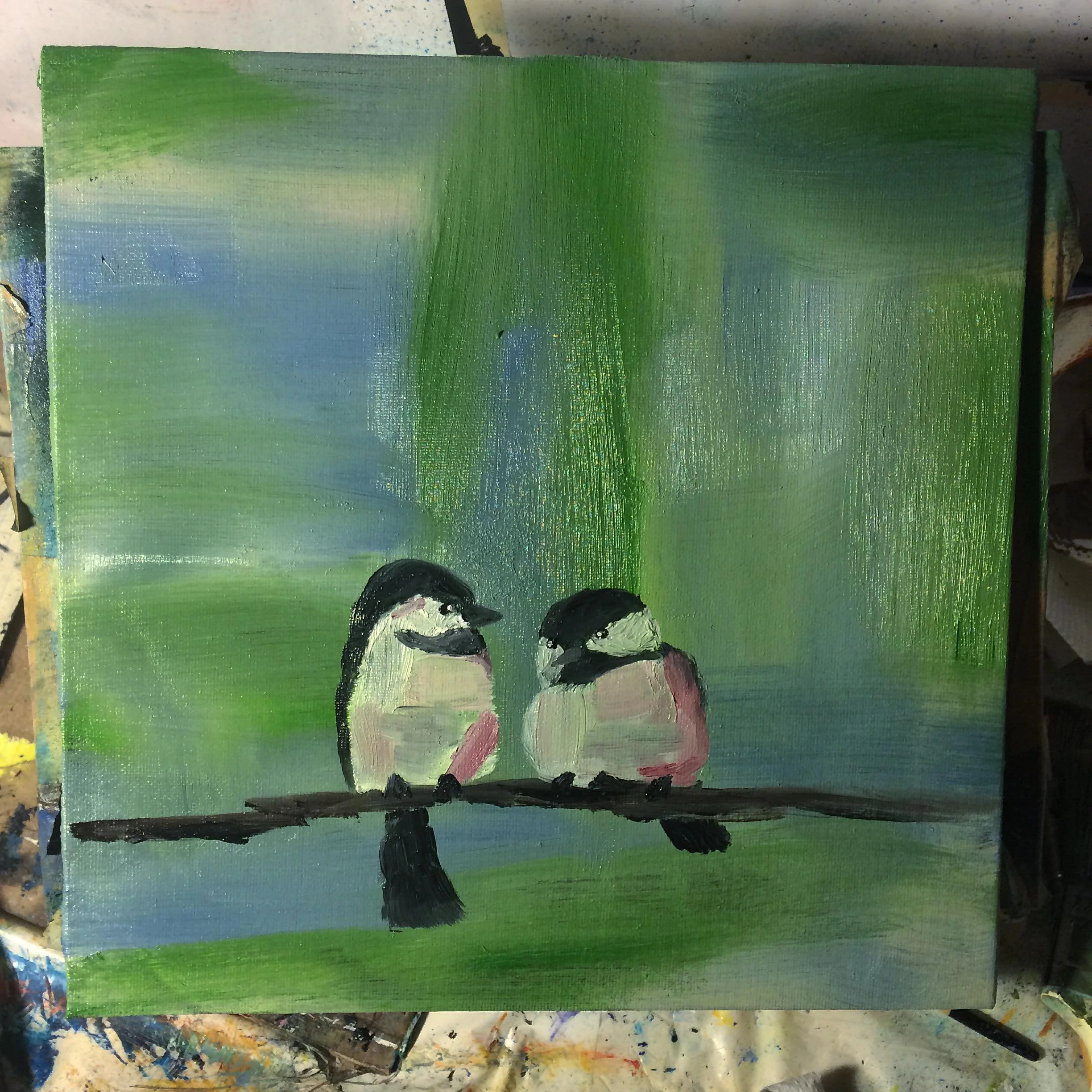 A painting of two small birds perched on a branch with a green and blue background.