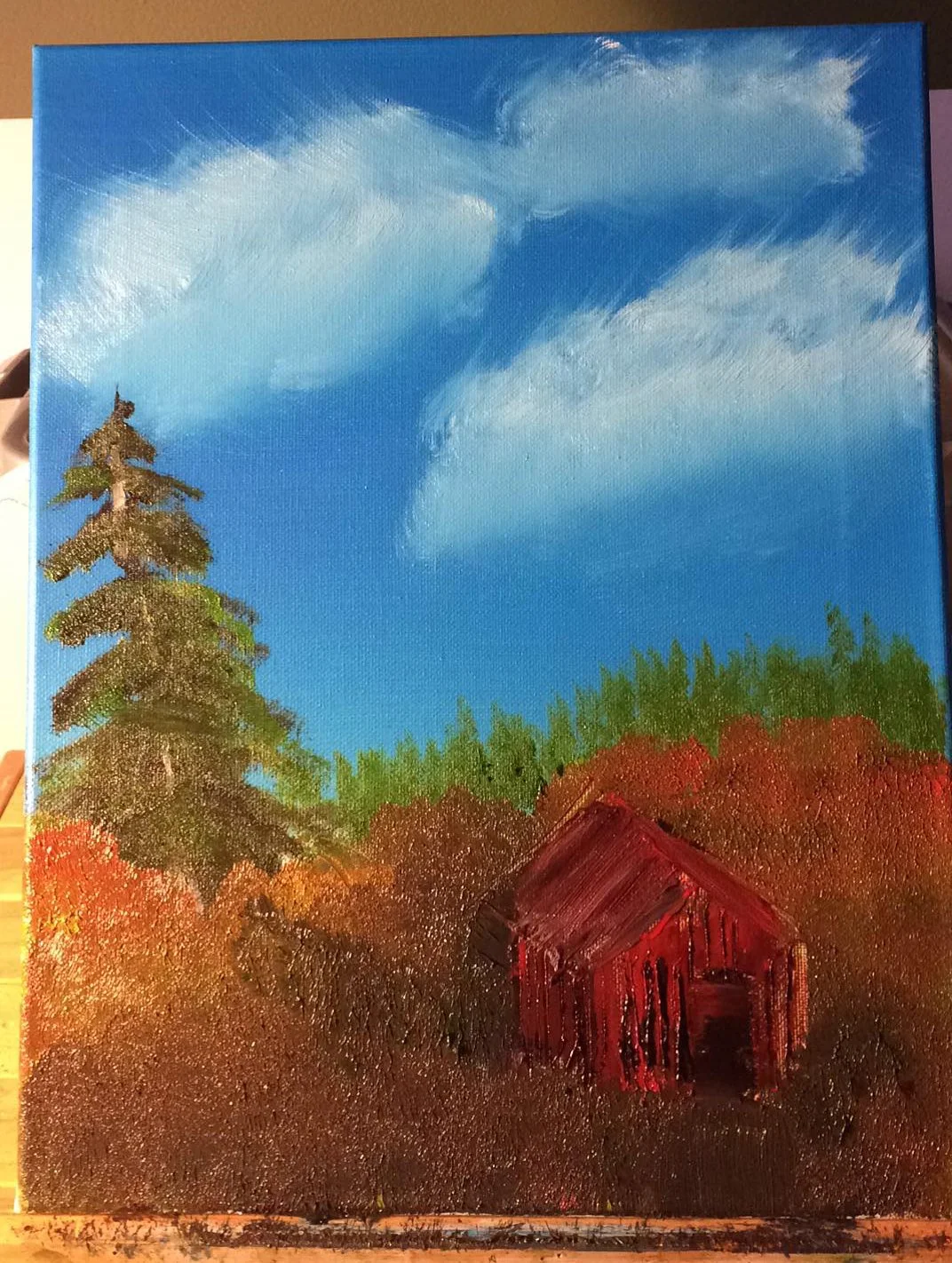 A landscape painting of a rural scene with a blue sky, white clouds, a tall pine tree on the left, a background of green trees, and a small red barn in the foreground.
