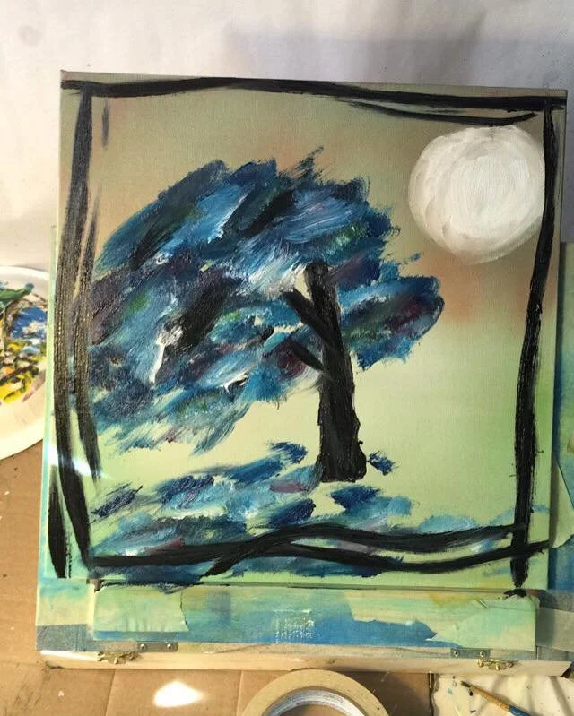 Painting of a tree under a full moon with a blue and black color palette, framed in black strokes.