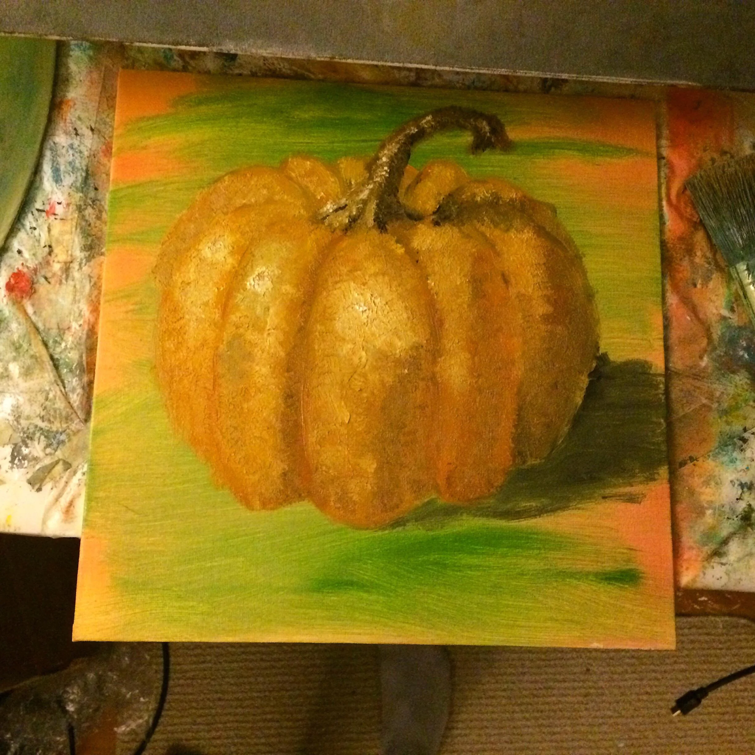 Painting of an orange pumpkin with a green background.