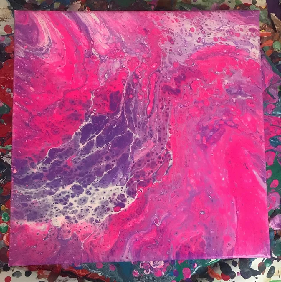 Abstract fluid art painting with pink, purple, and white swirling colors