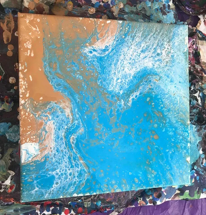 Abstract painting with blue, beige, and white swirls, resembling ocean waves or fluid motion.