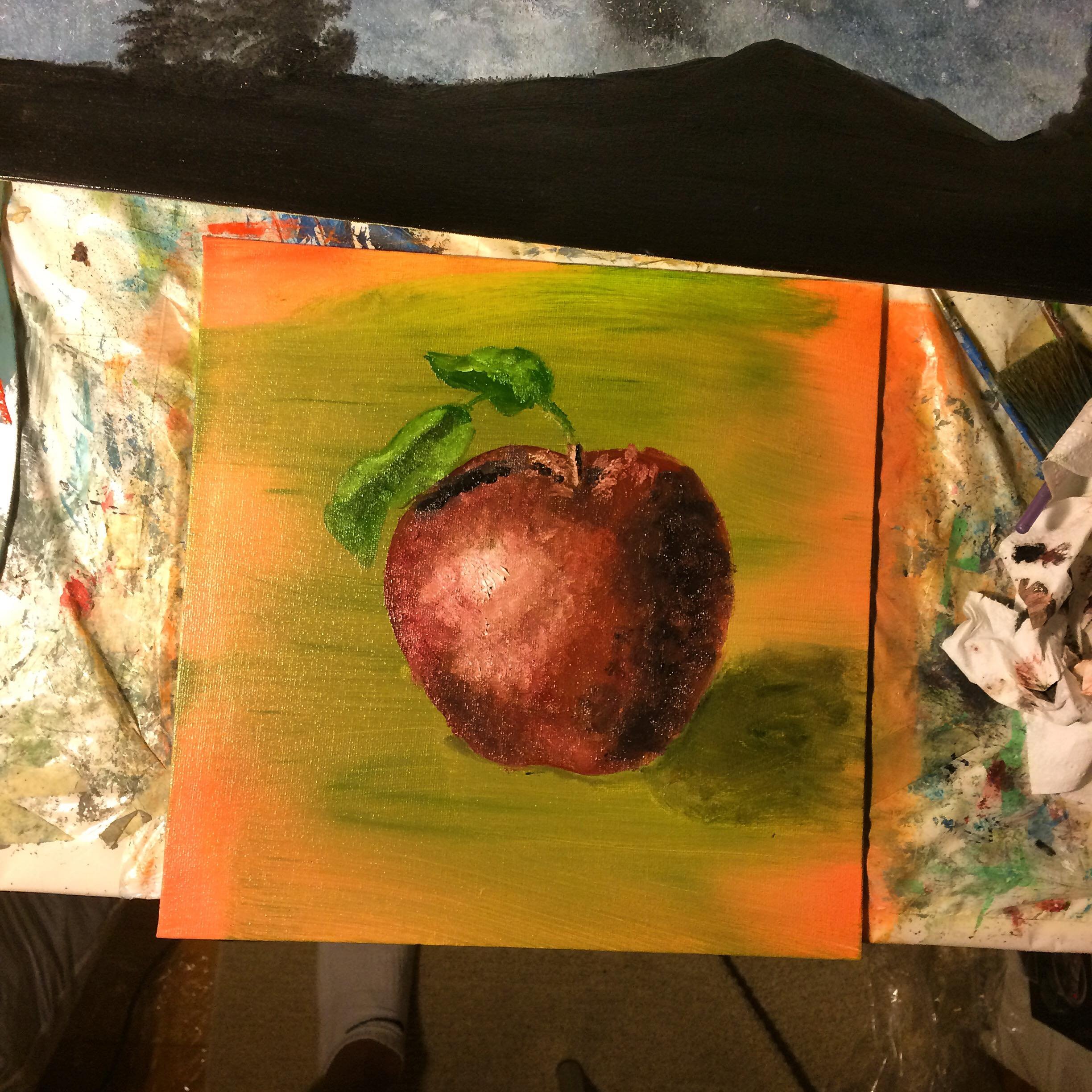 A painted picture of a red apple with green leaves on a vibrant green and orange background.