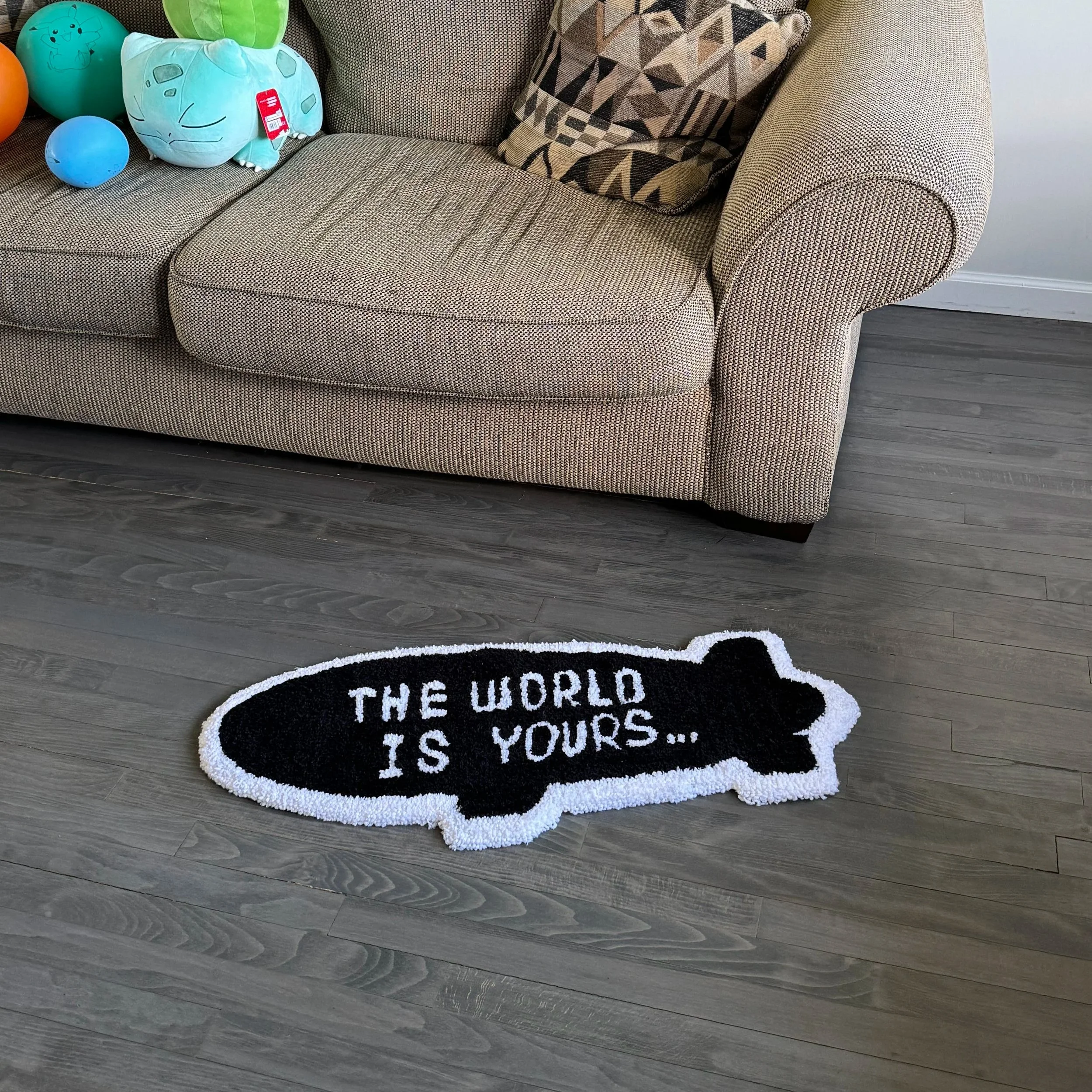 "The World Is Yours" Blimp Handmade Rug – 2.5ft by 1ft Acrylic Yarn