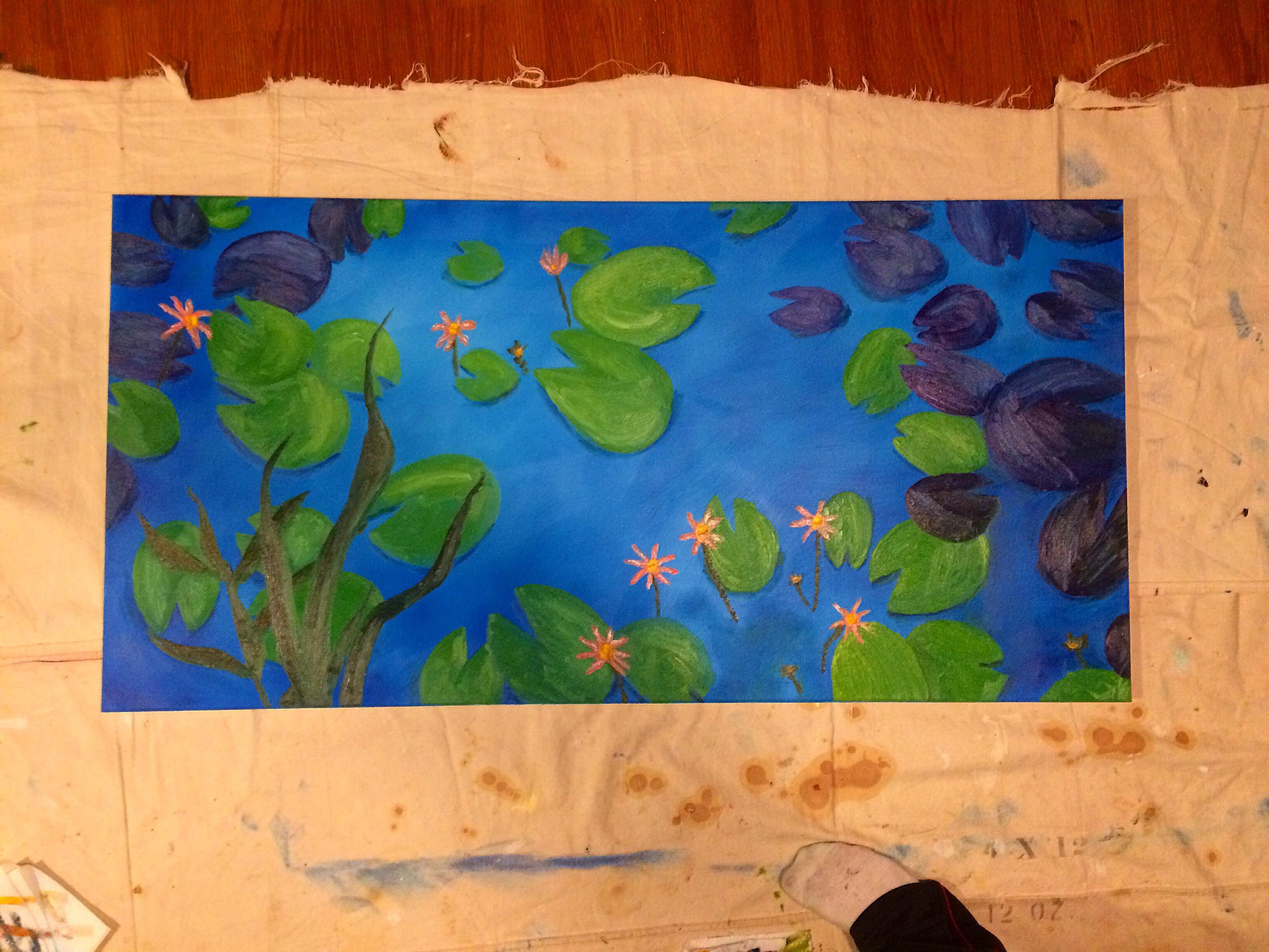 Painting of a pond with green lily pads, pink water lilies, and a blue water background.