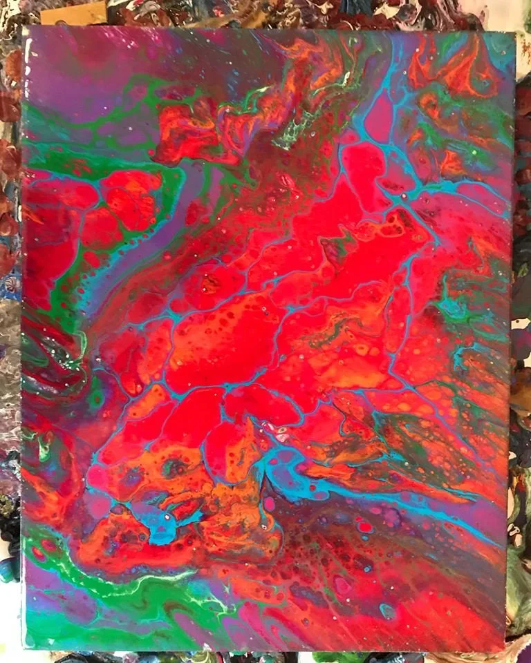 Abstract acrylic painting with vibrant swirling patterns of red, green, blue, purple, and orange.