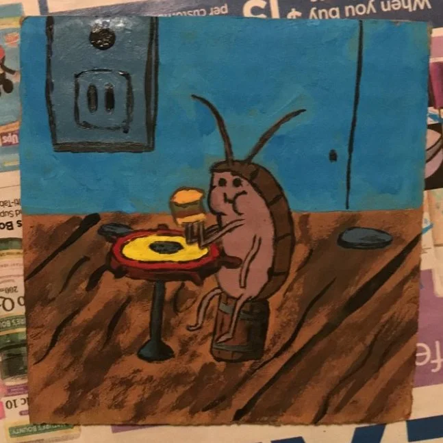 Cartoon drawing of a cockroach at a small table with a hamburger, eating the burger, in a room with a blue wall and electrical outlets.