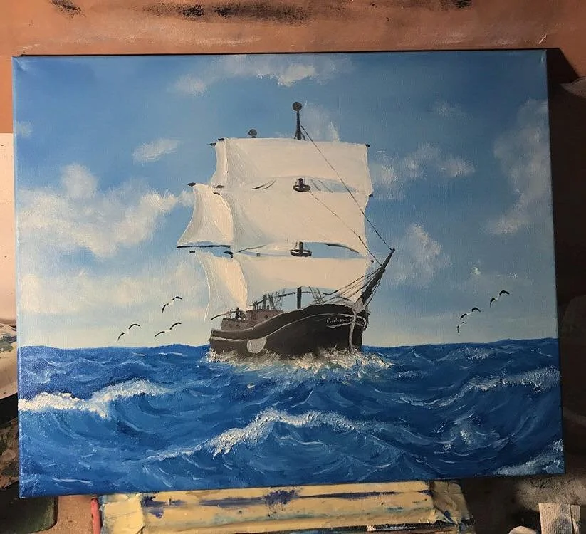 A painting of a black sailing ship with white sails on a blue ocean, with clouds in the sky and seagulls flying nearby.