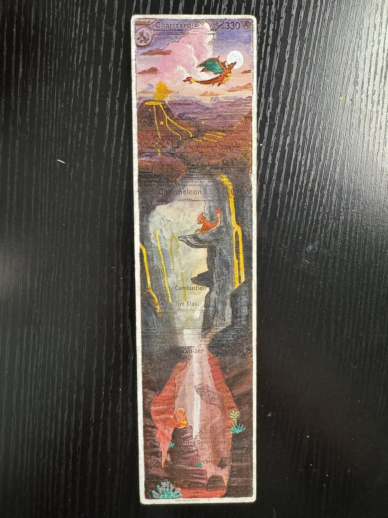 A Pokémon-themed novelty bookmark featuring artistic depictions of Charizard from top to bottom. The top shows a flying Charizard against a colorful sky, followed by a scene of a Charmeleon in a volcanic environment with lava flows, then a Charizard 