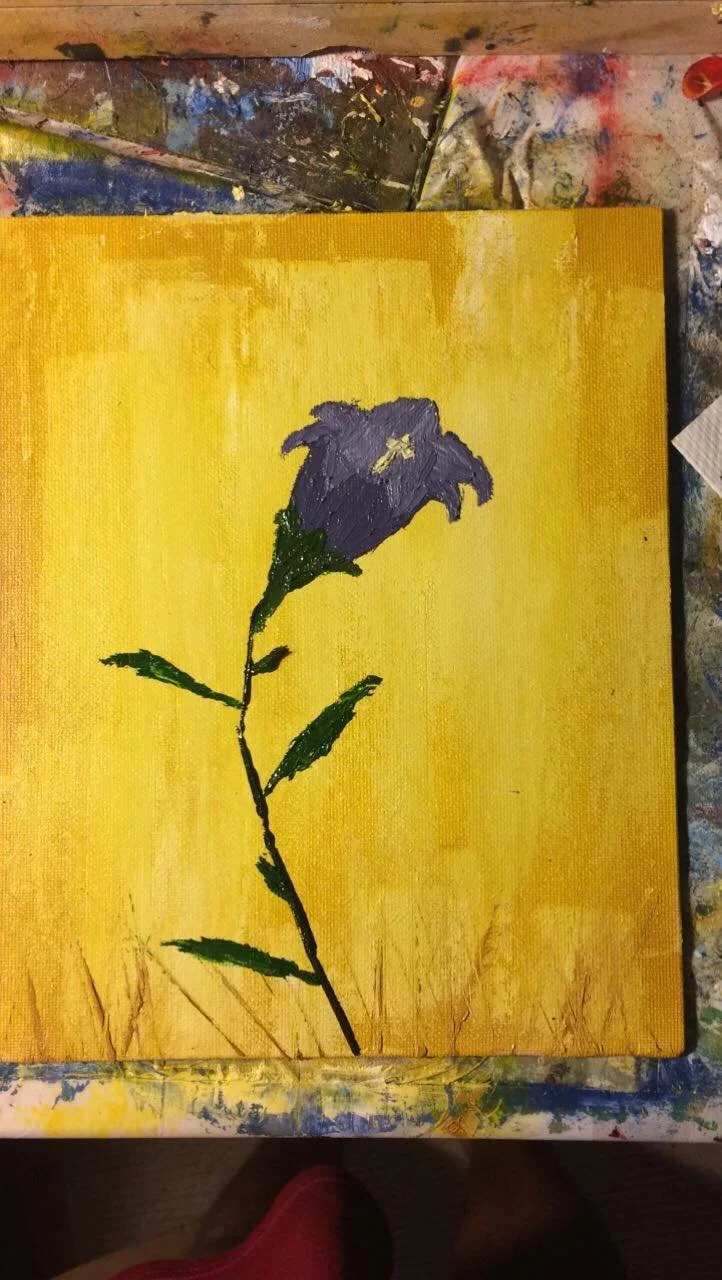 A painting of a purple flower with green leaves and stem on a yellow background.