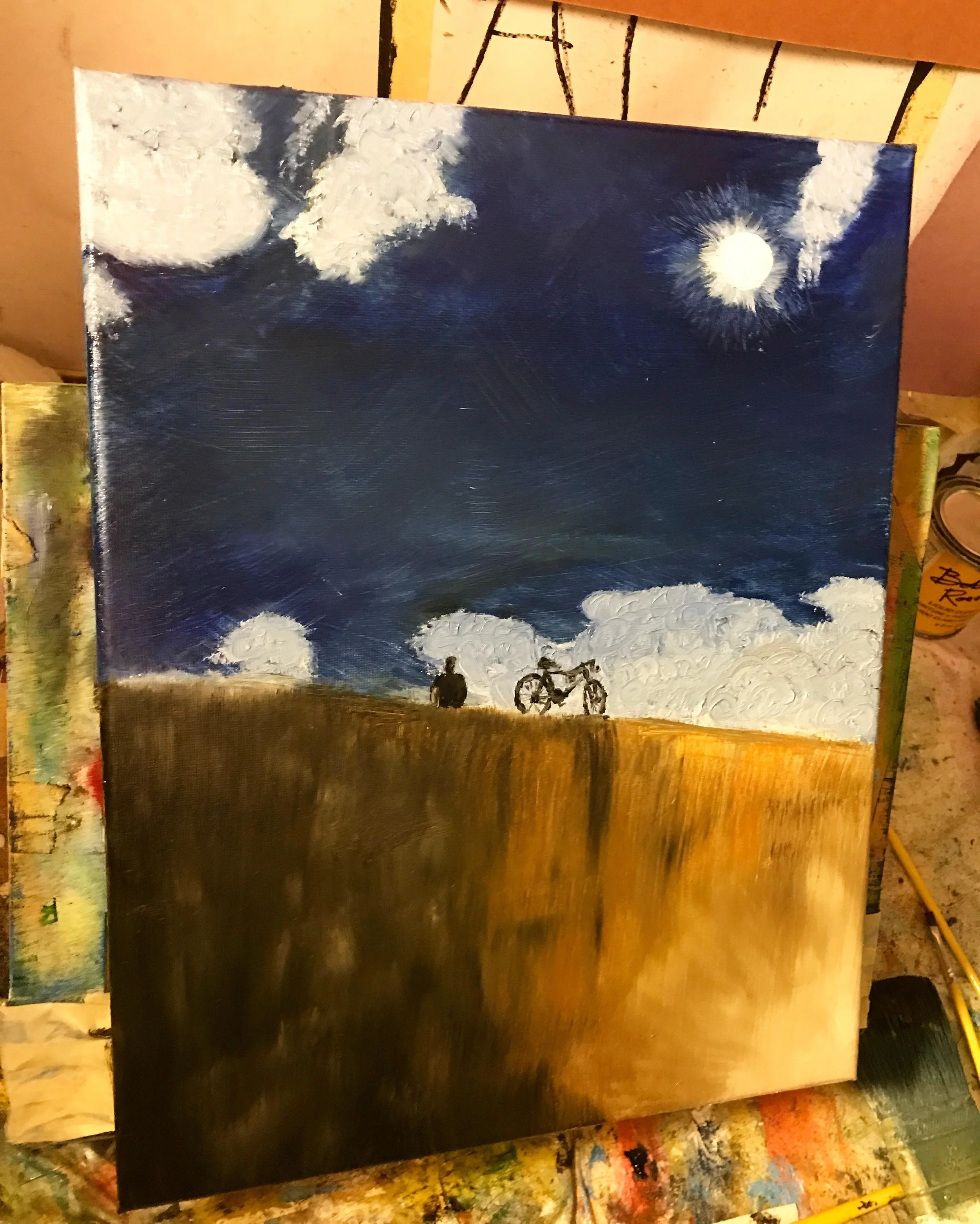 An oil painting depicting a night scene with a dark sky illuminated by a bright moon and clouds. In the foreground, a person and a bicycle sit atop a hill, silhouetted against the sky.