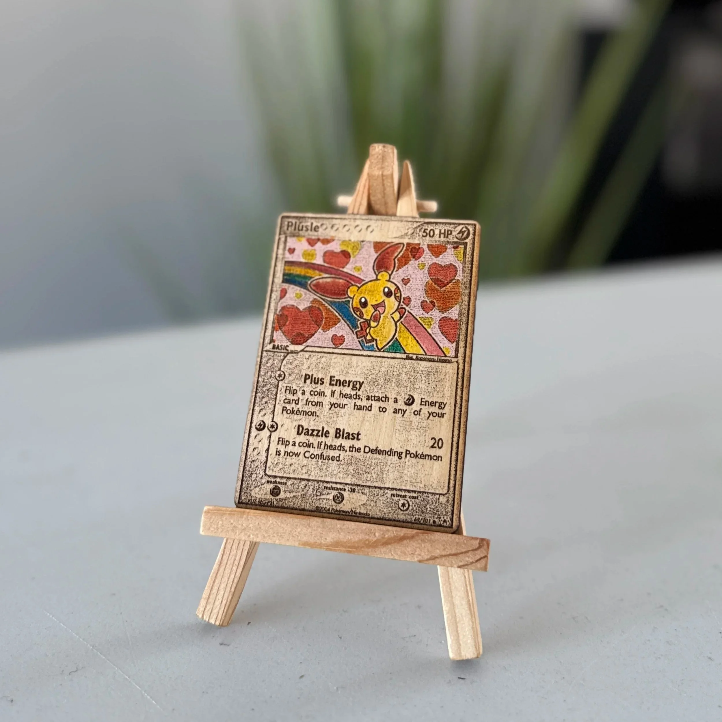 Plusle (69) Engraved Wooden TCG Card