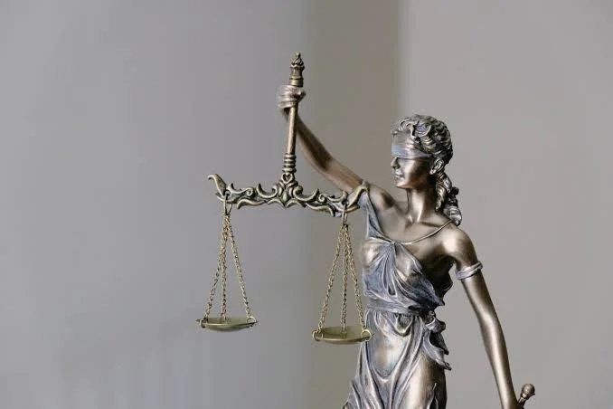 Statue of Lady Justice holding scales.