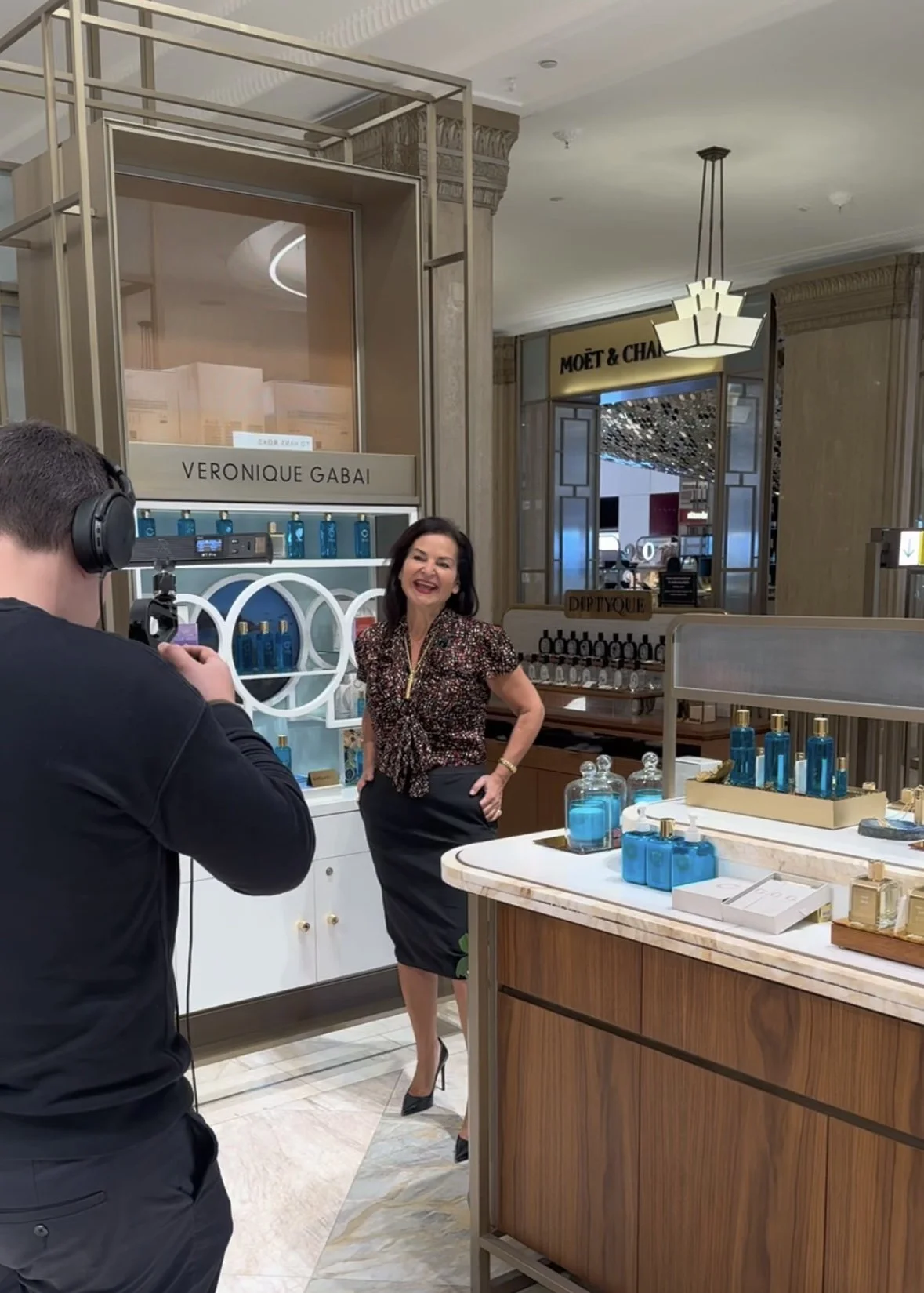 Veronique Gabai Filming For Harrods Channels At Her Store Counter