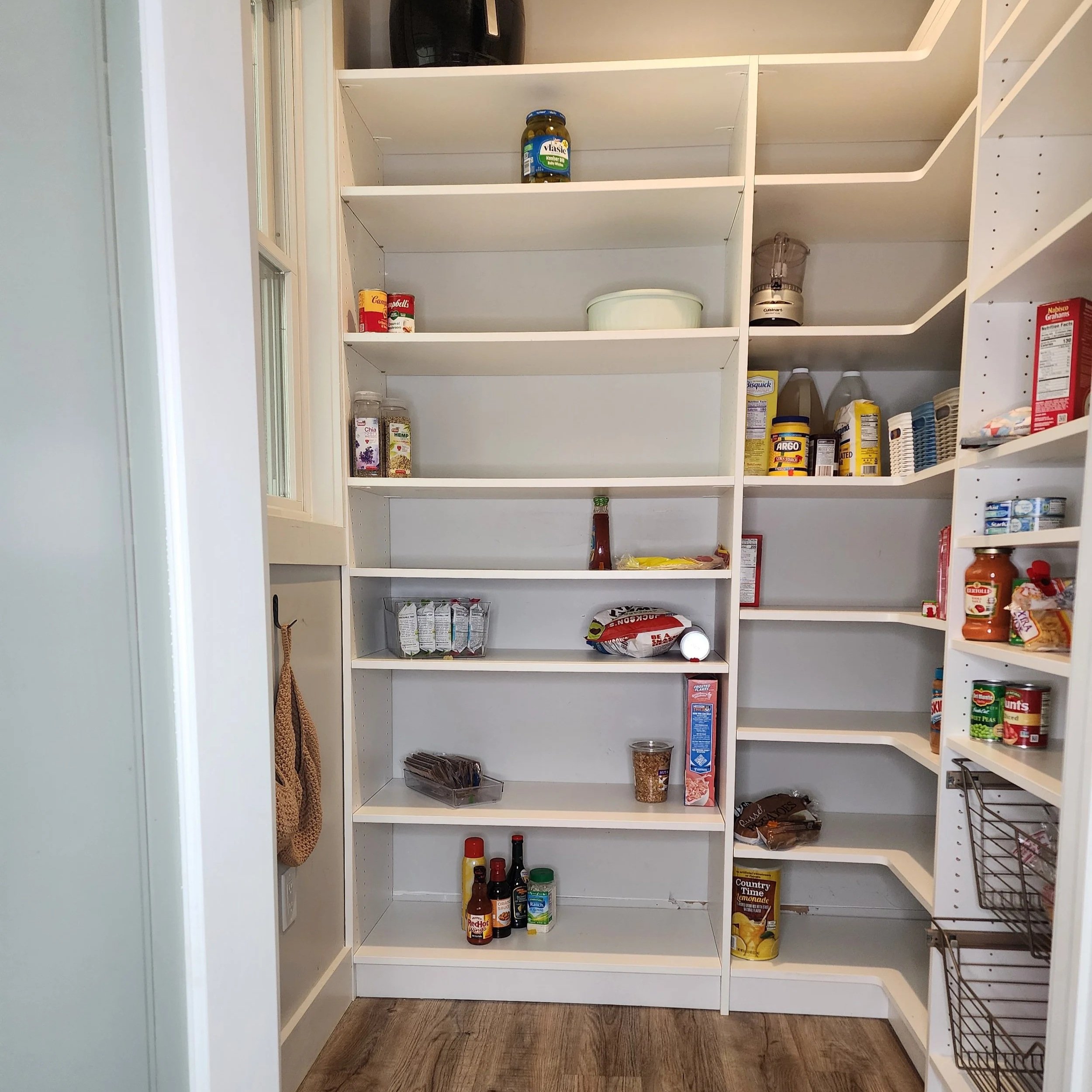 Walk-In Pantry with Corner Unit and Pull Out Wire Baskets.