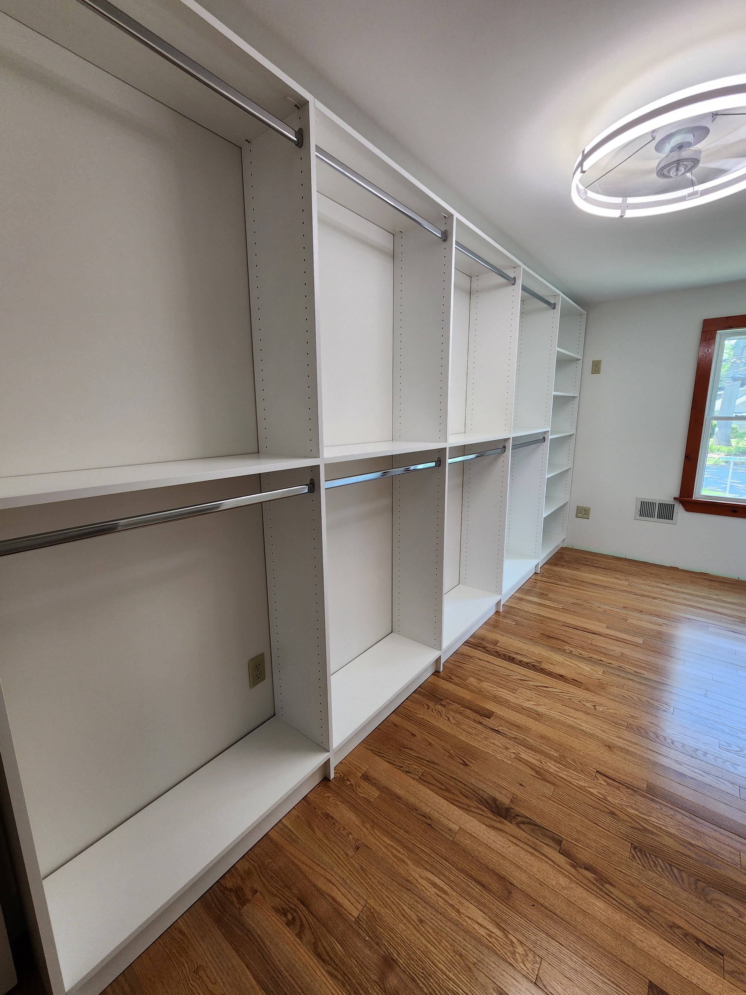 Bedroom turned walk in closet, plenty of room for hanging and shelves for shoes