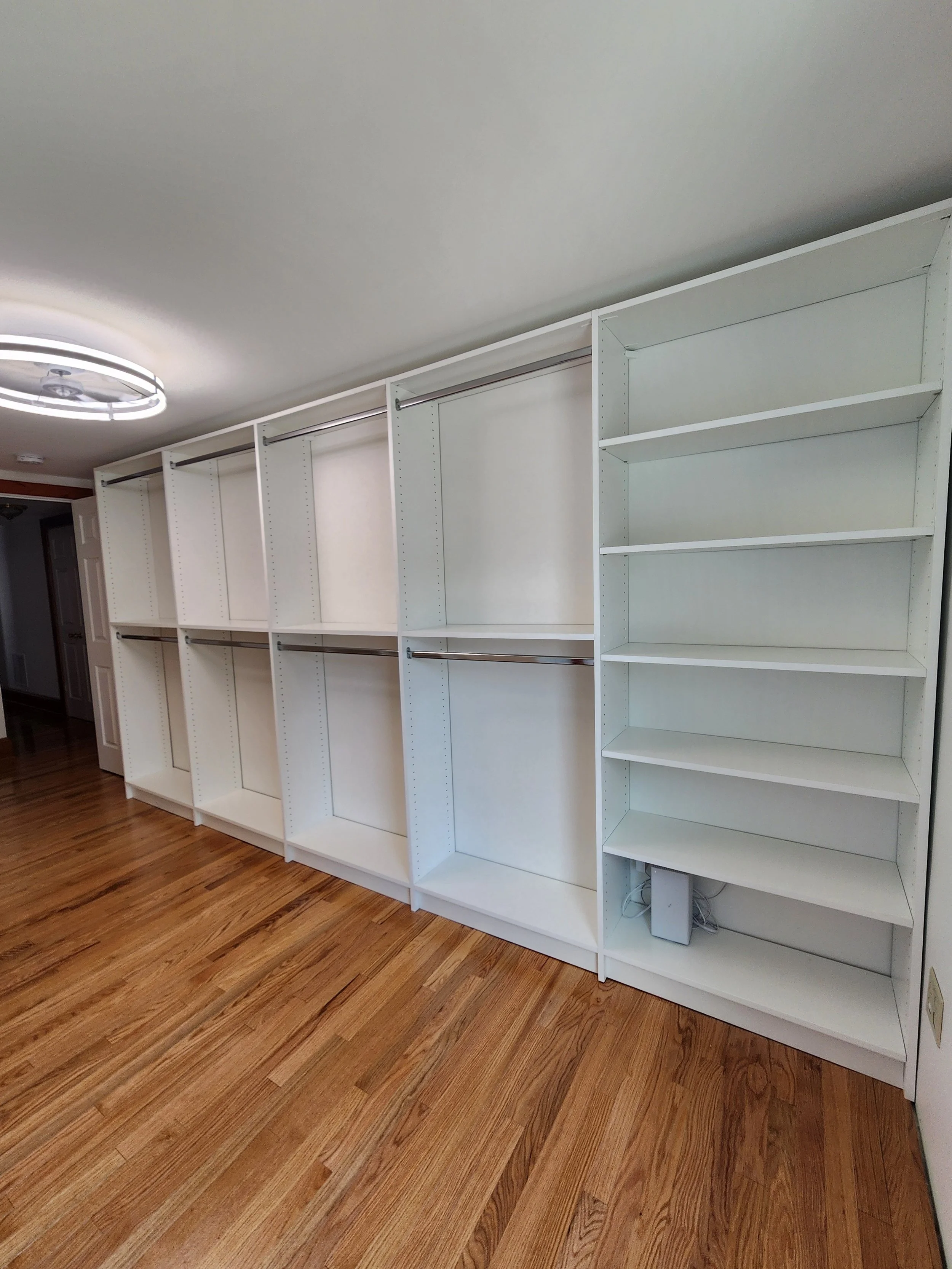 Bedroom turned walk in closet, plenty of room for hanging and shelves for shoes