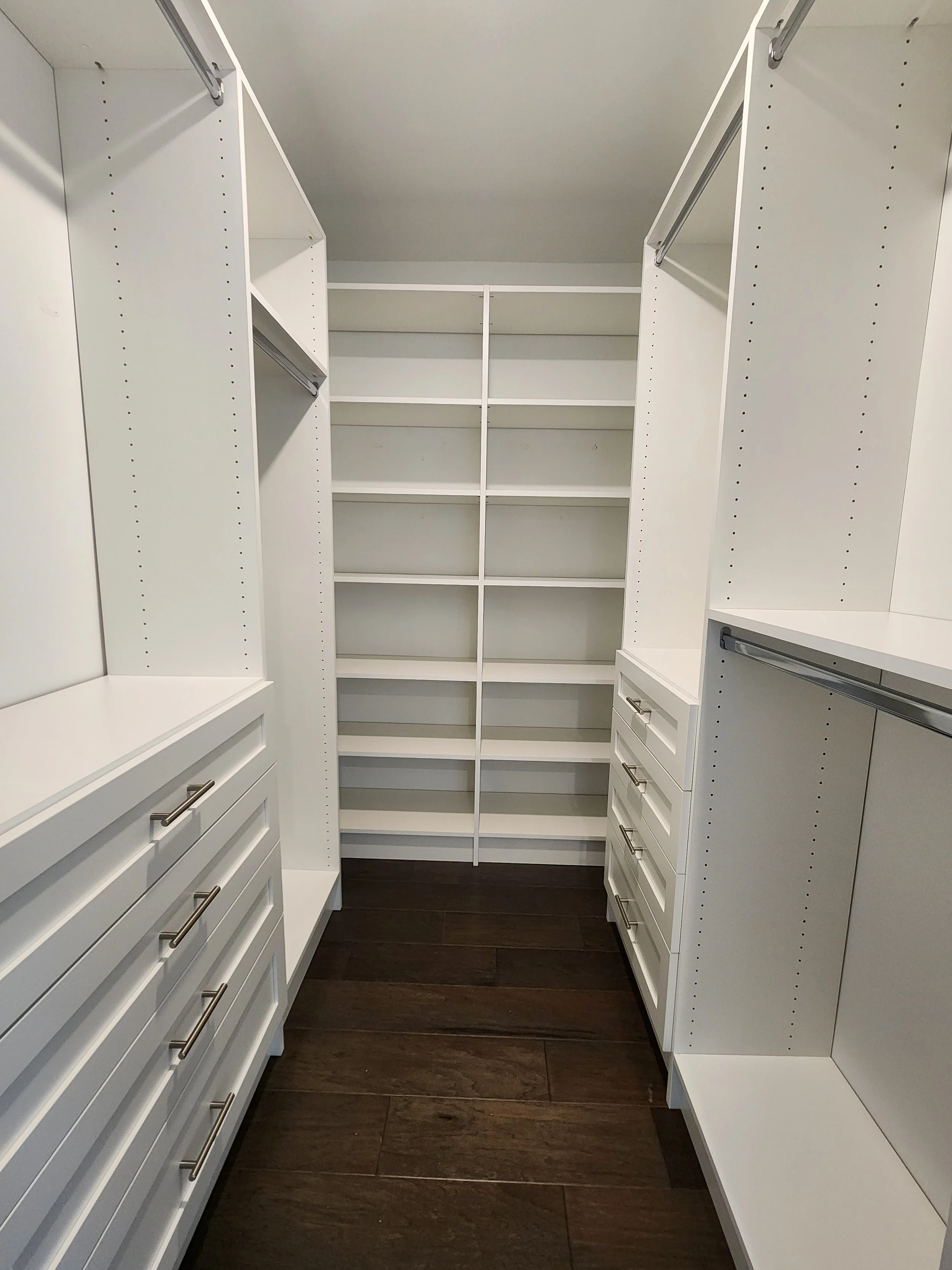 Whippany Primary Closet Walk In with 2 sets of drawers with shaker style and shelving on the back wall