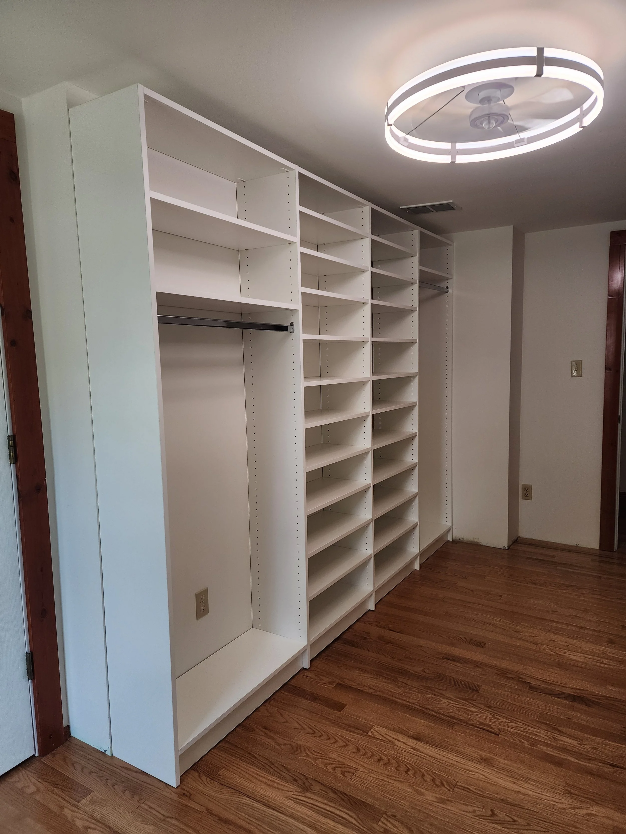 Bedroom turned walk in closet, plenty of room for hanging and shelves for shoes