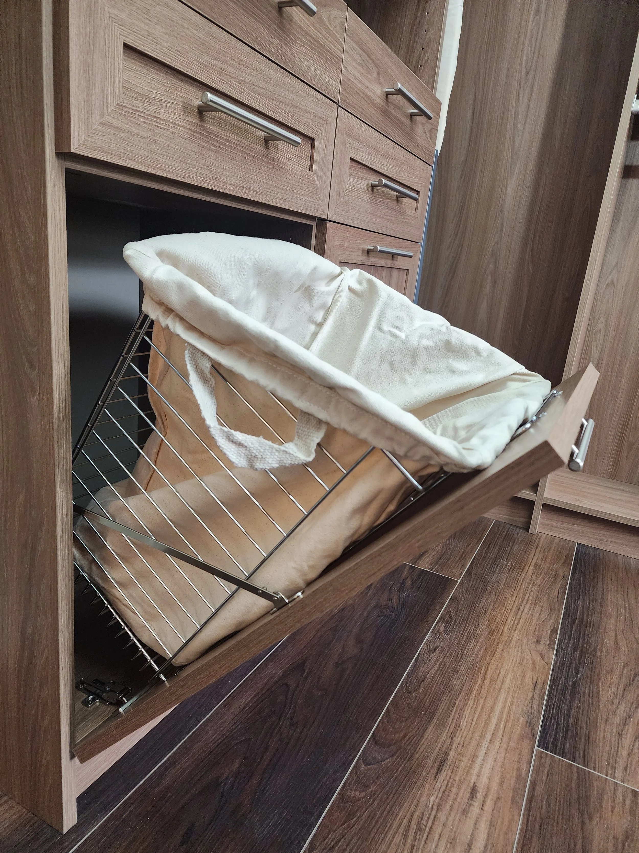 Tilt out hamper cabinet with canvas liner
