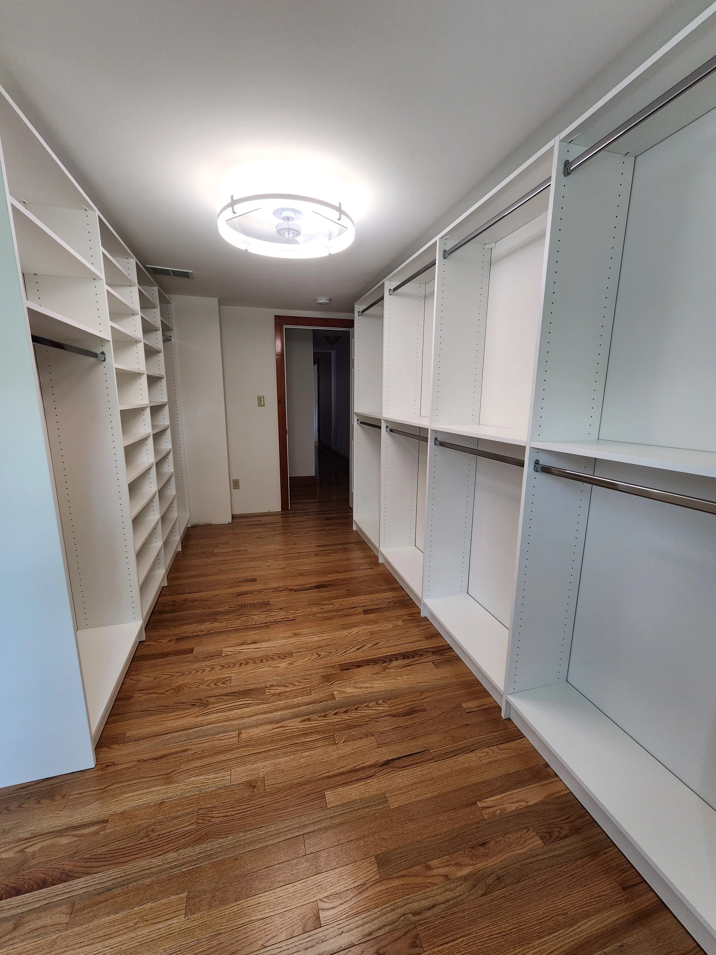 Bedroom turned walk in closet, plenty of room for hanging and shelves for shoes