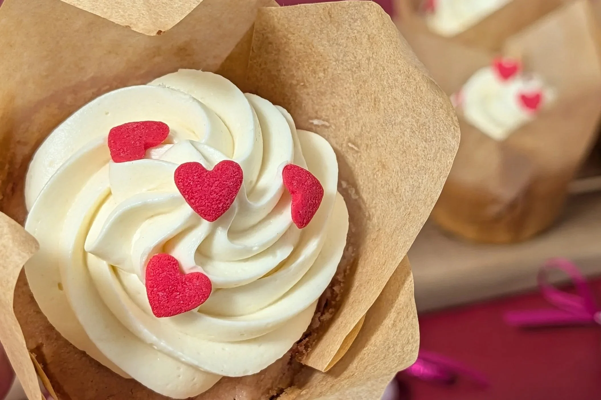 Close-up of strawberry cupcake with heart sprinkles (Copy)