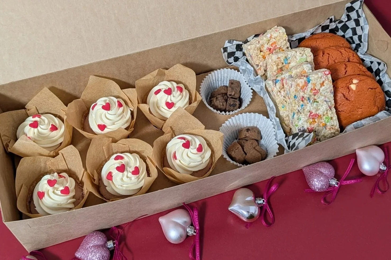 Boo Box contents: four strawberry cookies, four fruity rice krispy treats, six strawberry cupcakes, and heart shaped chocolate truffles