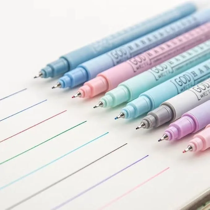 Pastel colored markers on paper with colored lines corresponding to each marker.