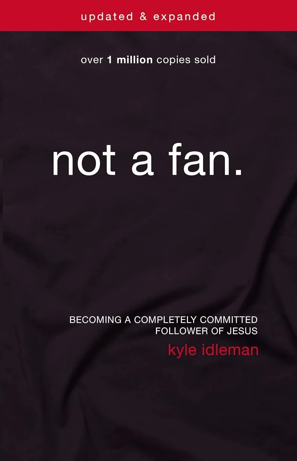 Book cover with red and black background, titled 'not a fan.' by Kyle Idleman. It mentions over 1 million copies sold and describes becoming a fully committed follower of Jesus.