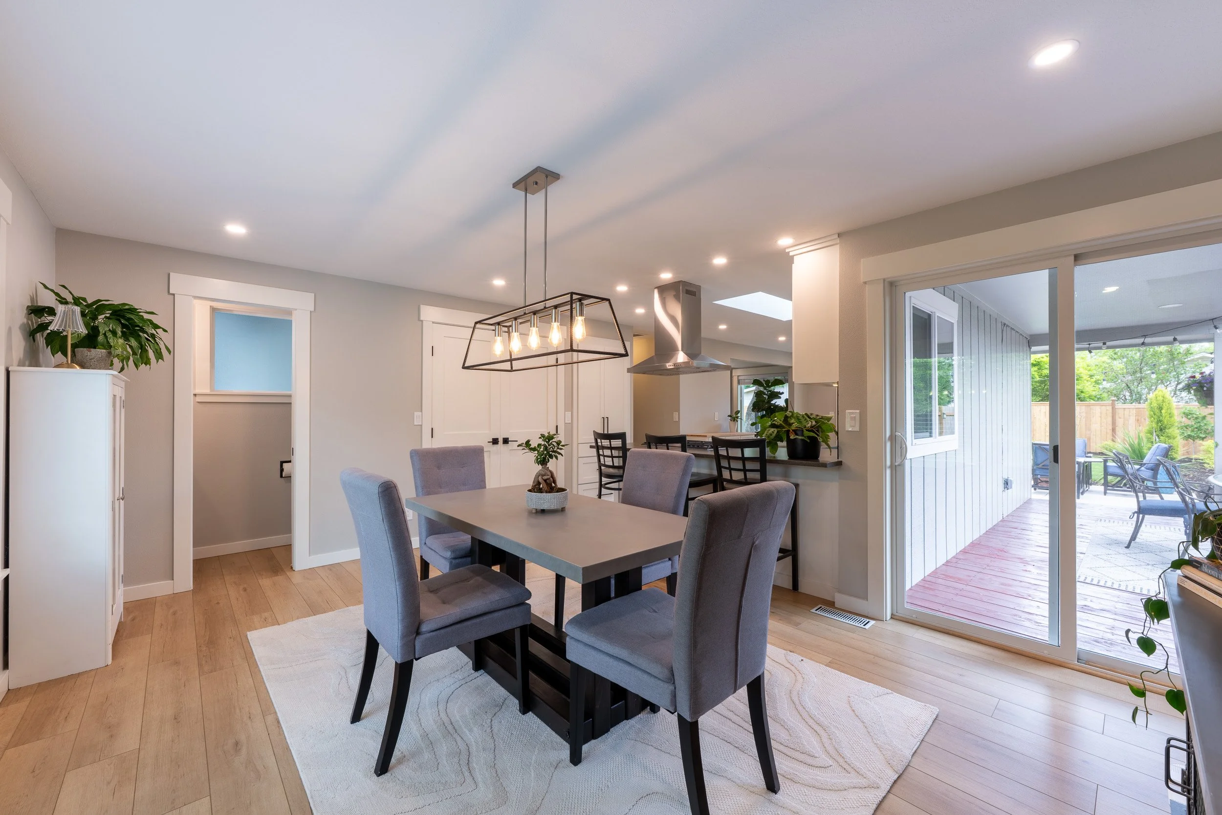 Living room with fireplace, built-in shelving, and neutral seating