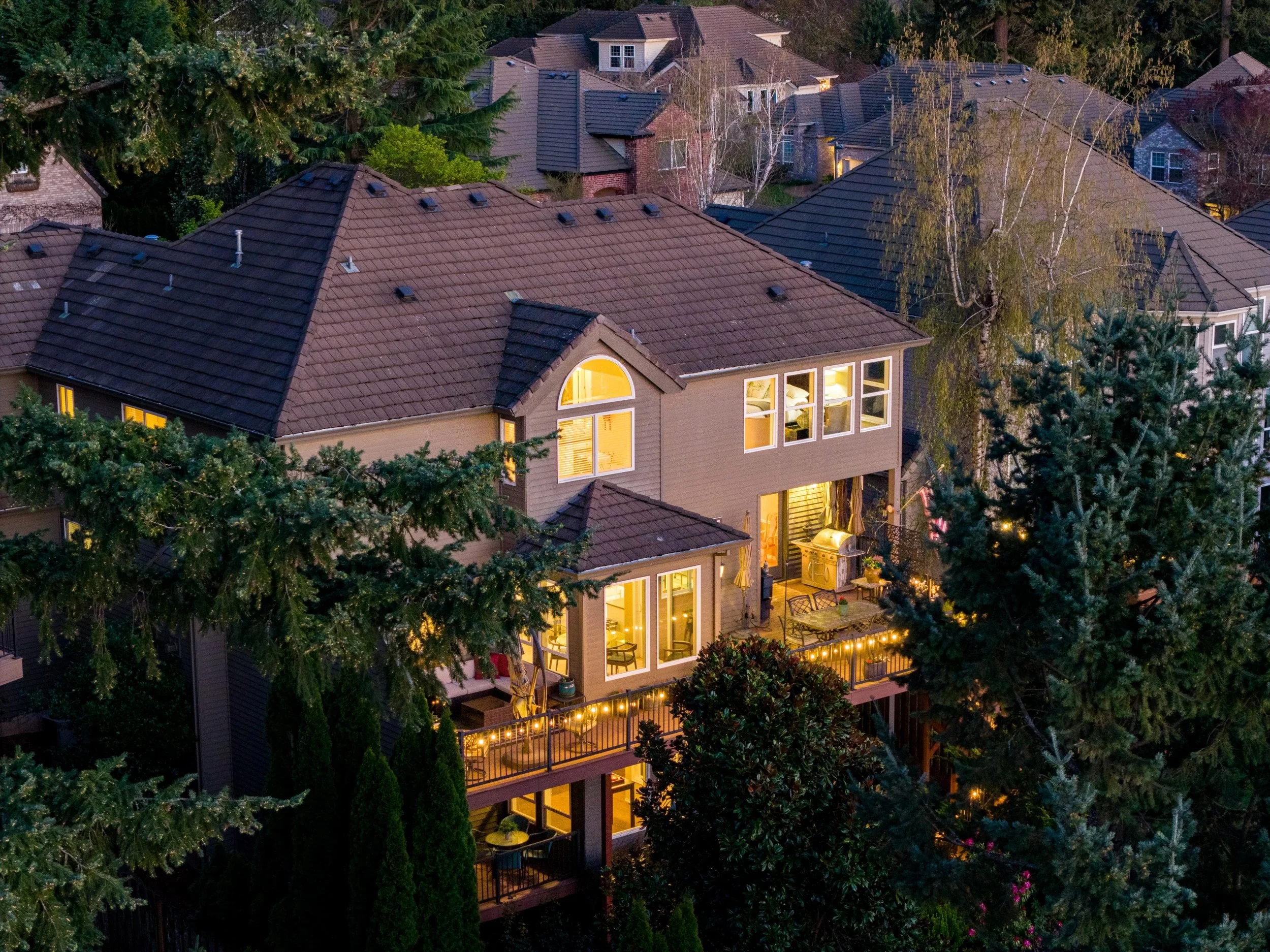 Twilight drone photo featuring the upper deck of a home in Beaverton, Oregon
