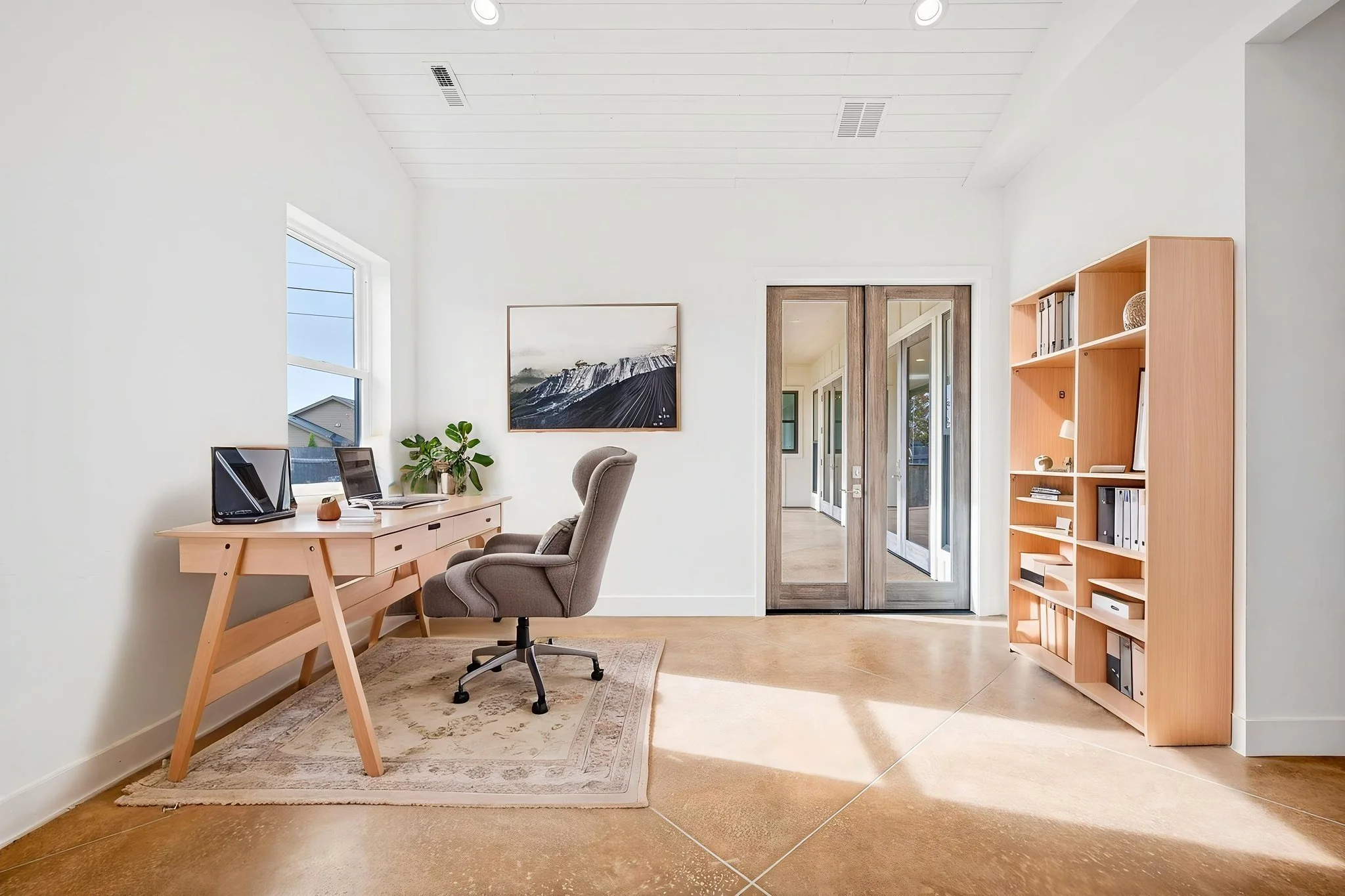 Virtually staged "after" photo of an office with Scandinavian style furniture