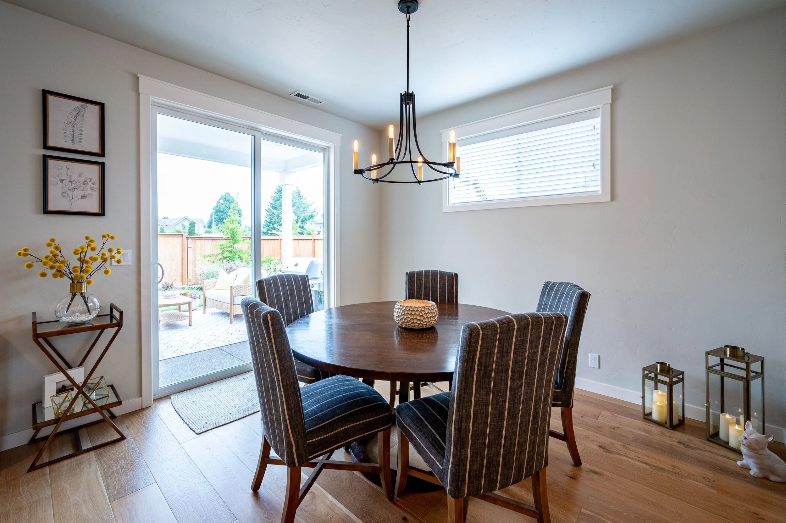 Dining area with round table, sliding doors, and outdoor views