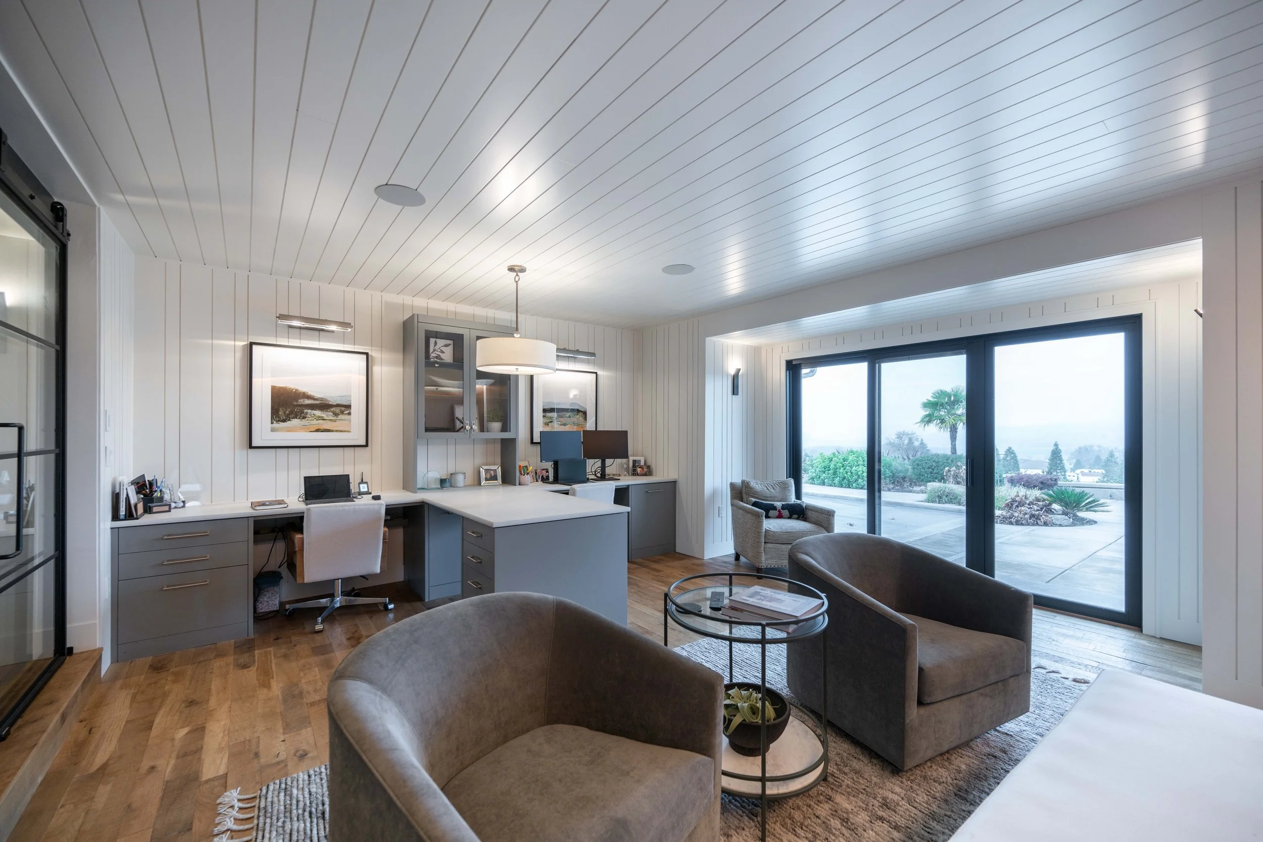Office with built-in shelves and natural light