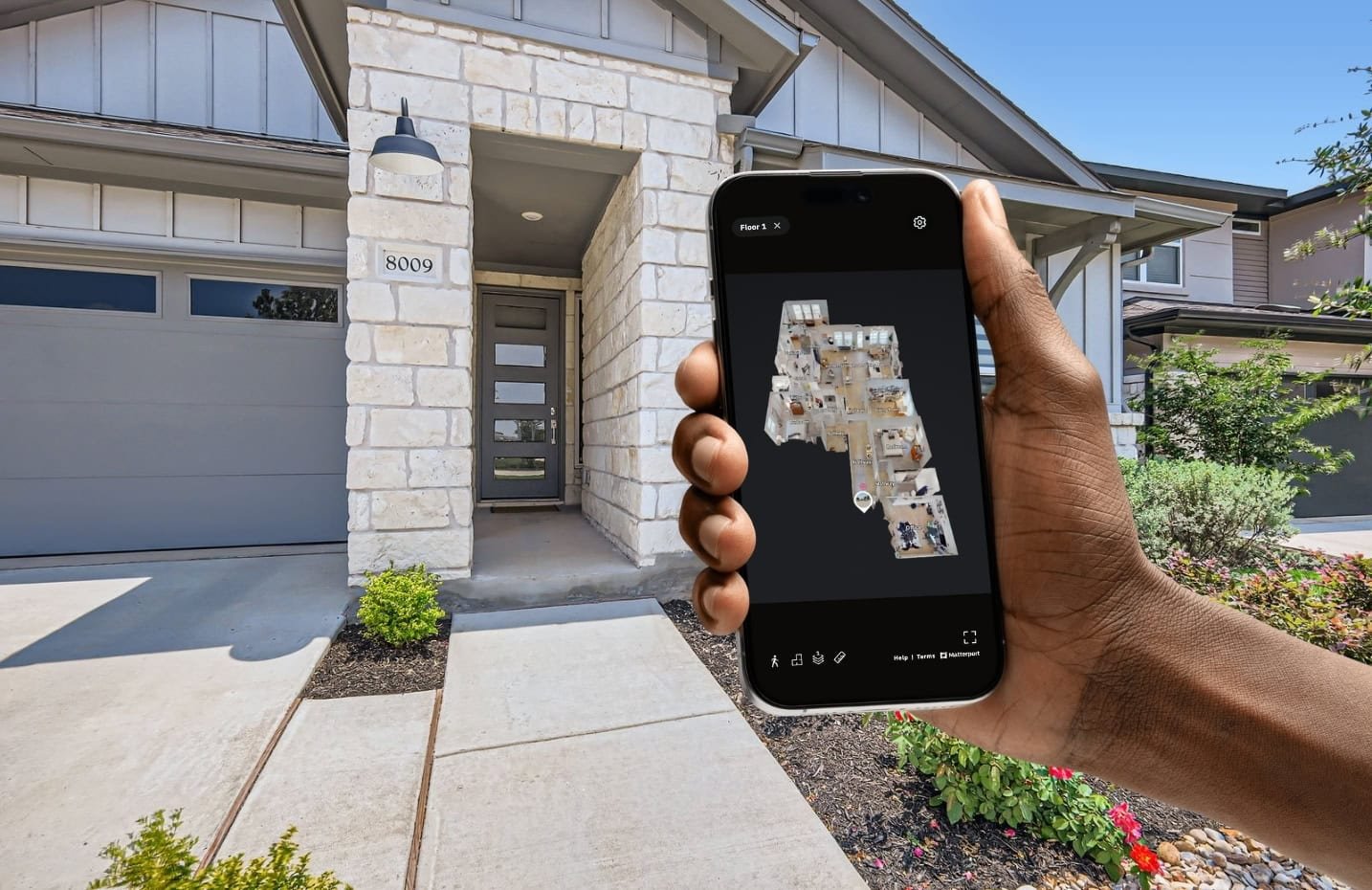 Hand holding a phone for a Matterport 3D Tour