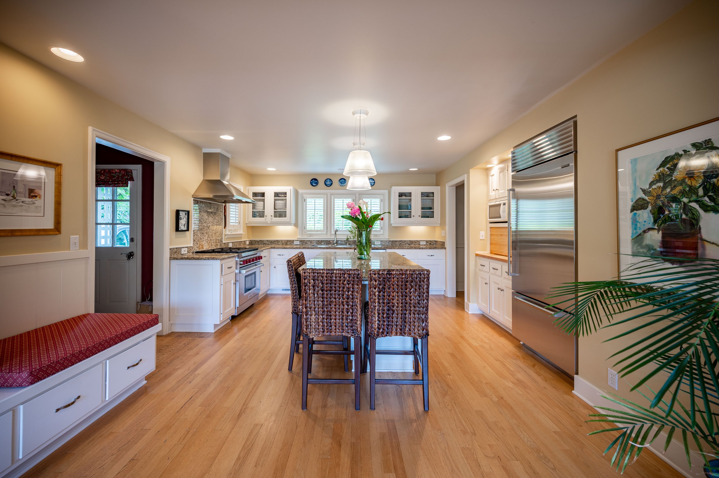 Wide kitchen view with island seating and open layout