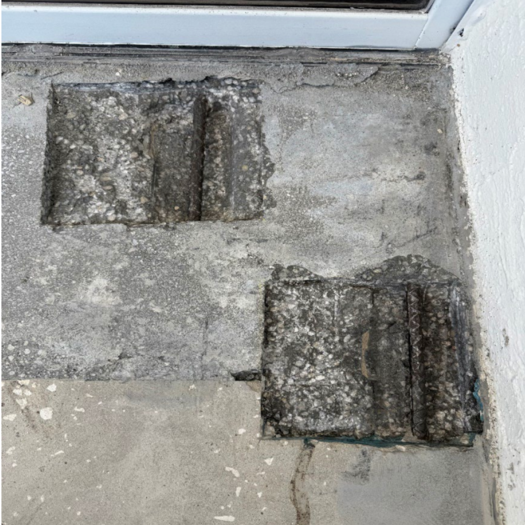 In-progress demo and removal of failed concrete to expose structural steel.