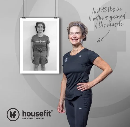 Smiling woman in athletic clothing standing beside a before-and-after sign showing weight loss from 33 pounds. The sign reads, 'lost 33 lbs in 11 months & gained 4 lbs muscle.'
