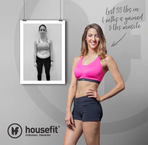 Woman in pink sports bra and black shorts smiling, with a before-and-after progress photo on the wall showing weight loss and muscle gain, with an annotation about losing 33 pounds and gaining 5 pounds of muscle.