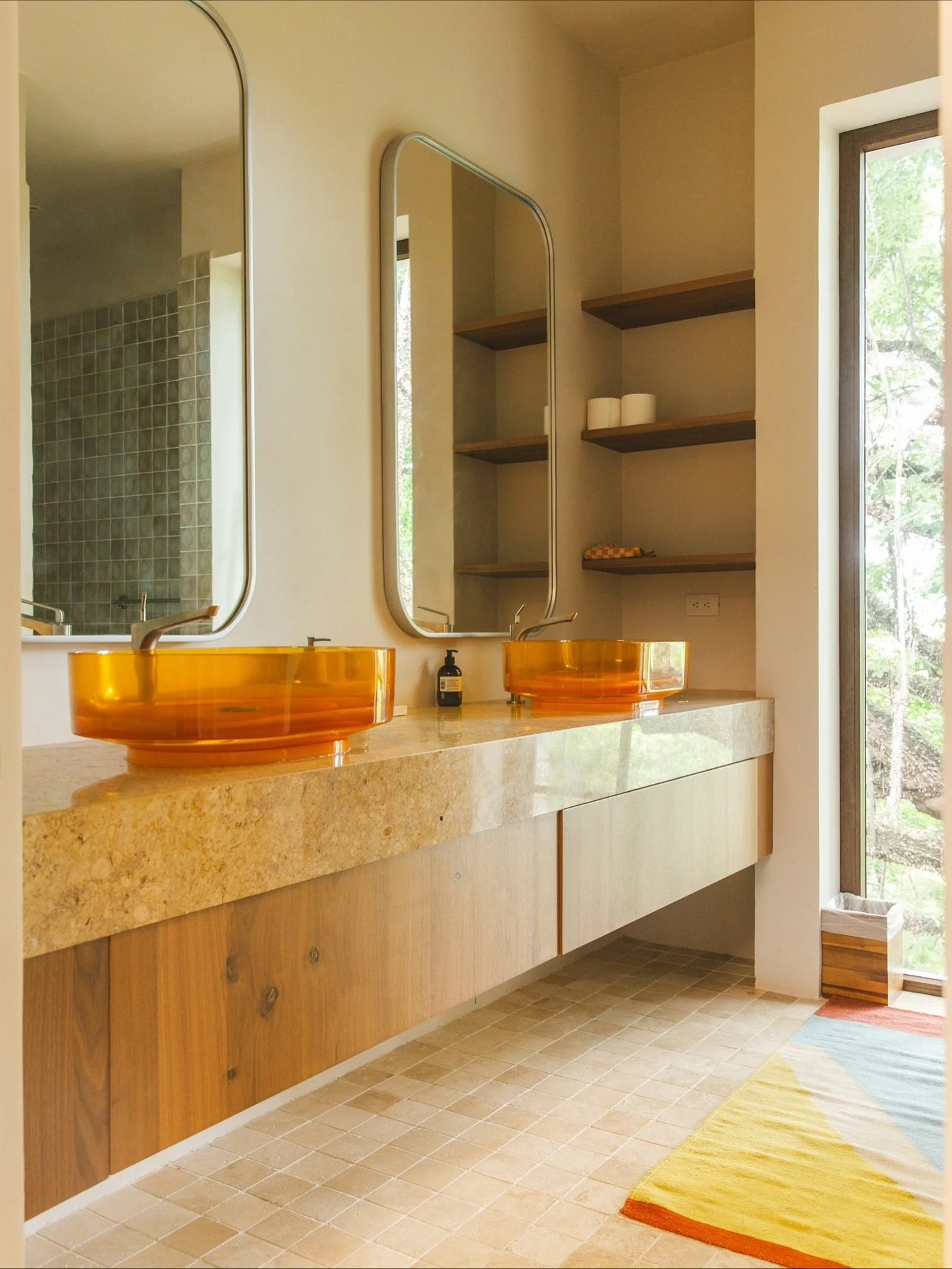 We have a thing for bathroom details ✨ 
The primary bath with amber glass sinks, diffused light and a deep tiled shower in our Santa Teresa jungle hideaway is 🤌🏽🤌🏽

@famm.arquitectura 

Now booking early spring 2026 - Airbnb link in bio 

#Gather