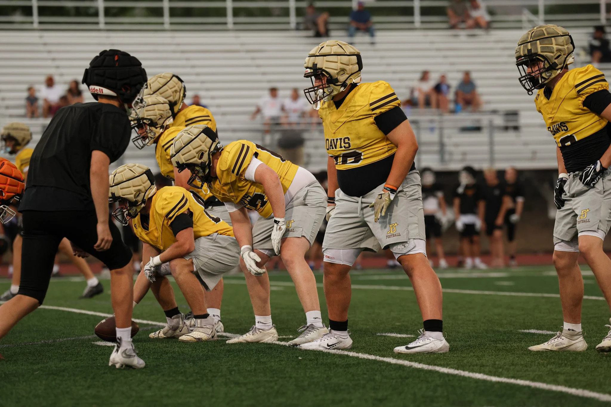 Lineman prepare for the next play.