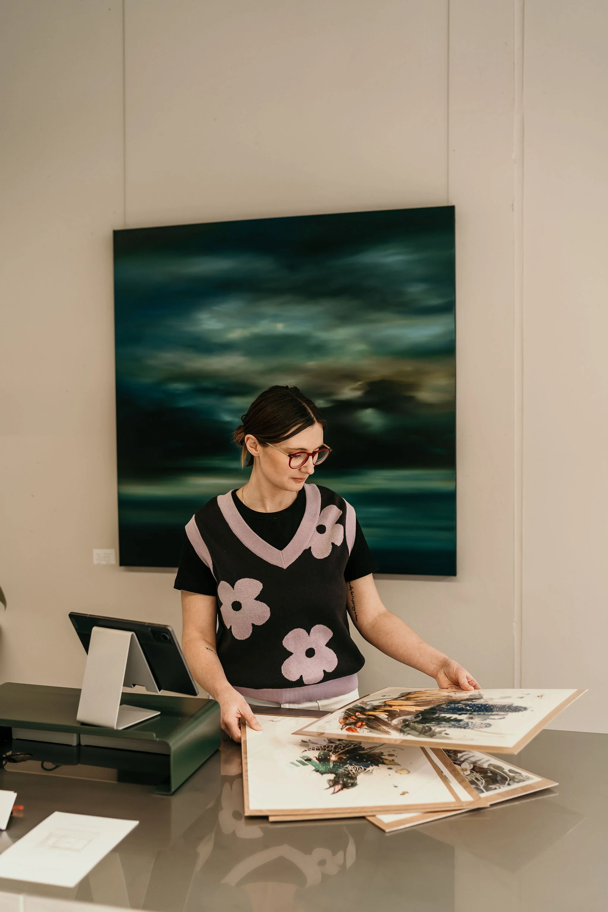 Ashleigh curating an art collection 