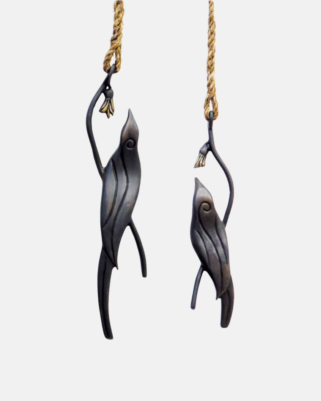 Jay Lloyd Koa Bronze Hanging Sculptures.png
