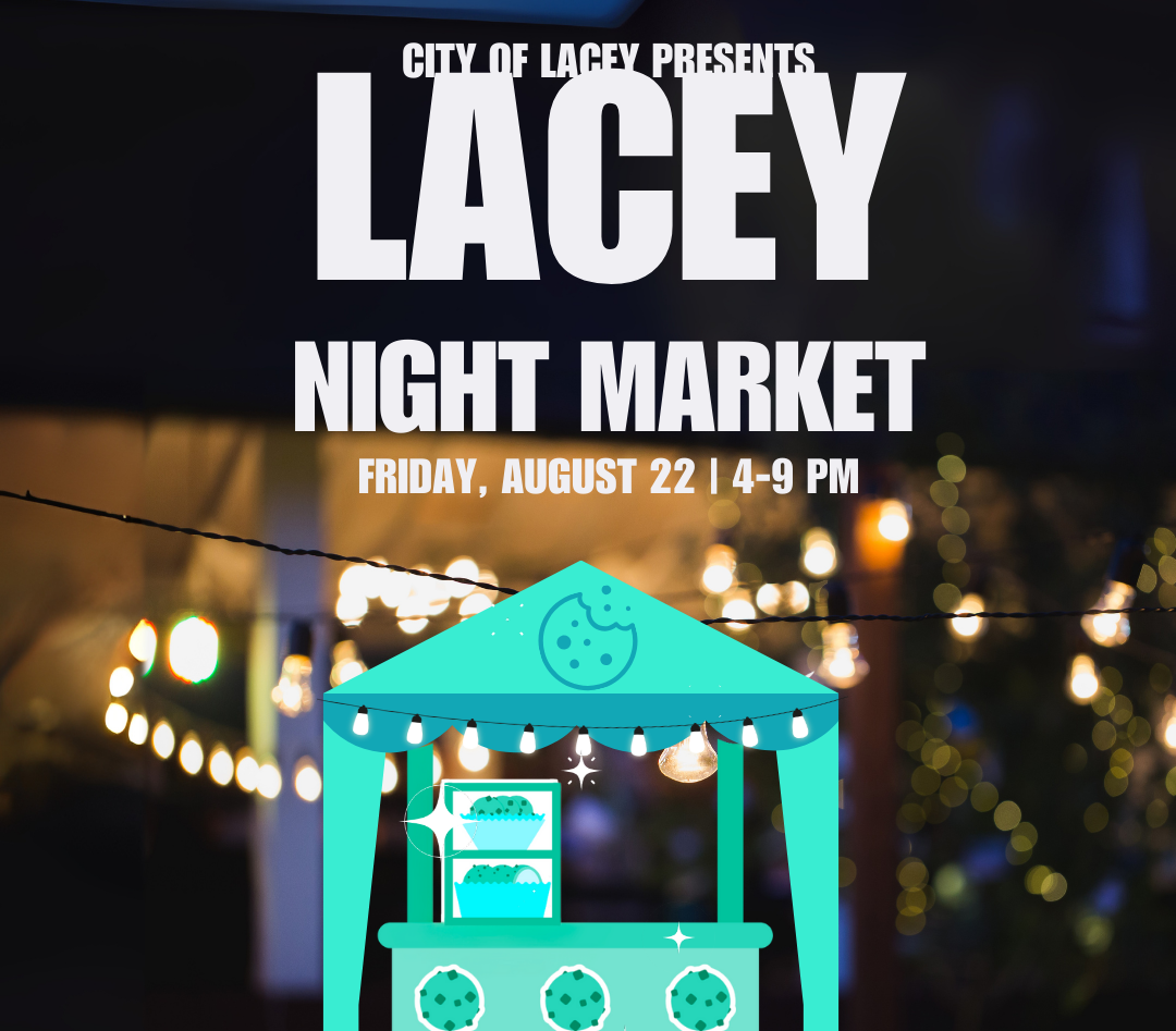 A table decorated with blue tablecloth and drapery, offering cookies and baked goods for sale, with signs indicating prices, inside a room with reddish-brown walls.