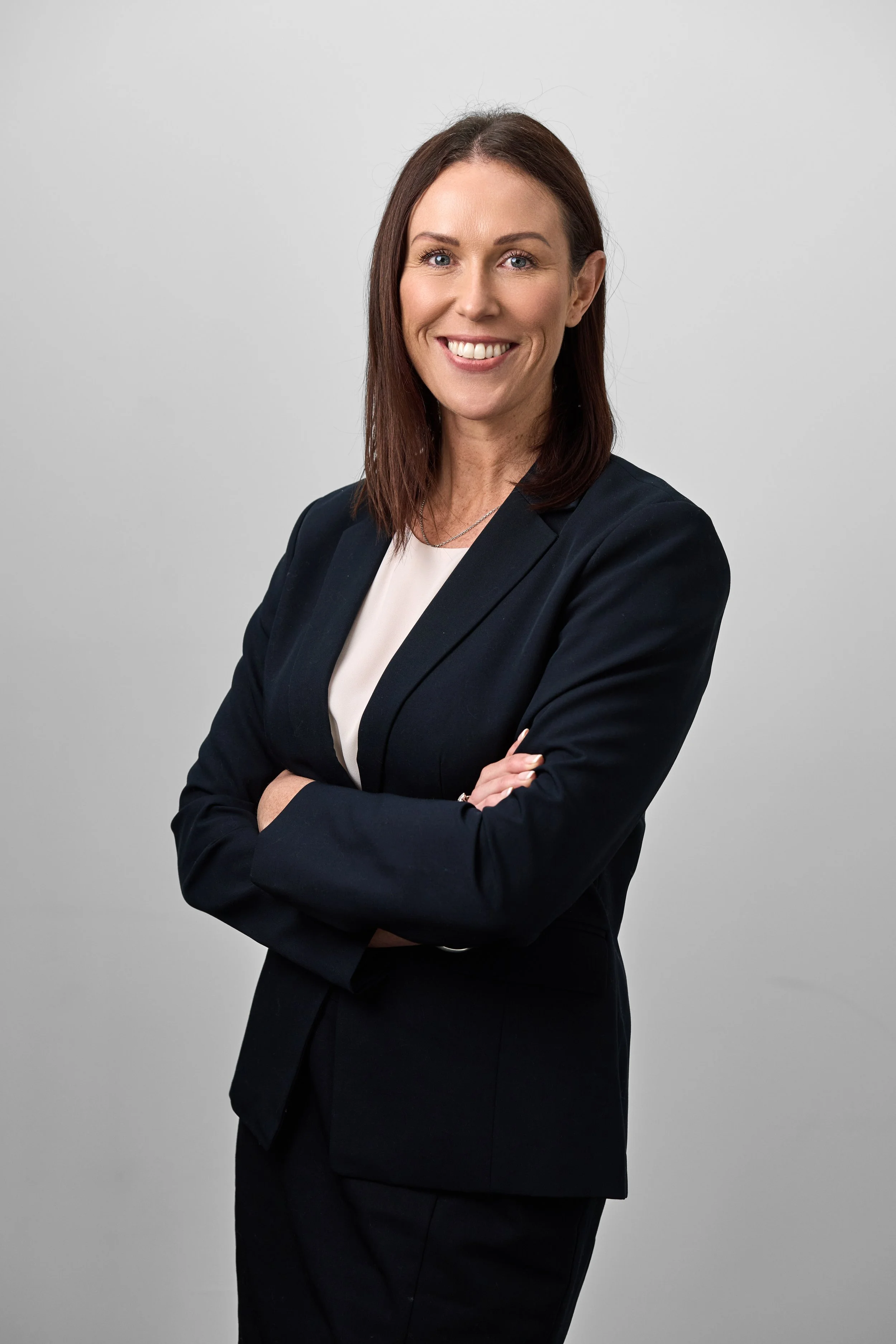 studio-headshot-female-white-backdrop-realestate-agent