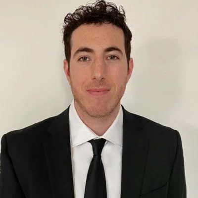 Alex Rosenberg, Vice President of Tomorrow Education, supporting the organization’s mission as an international education nonprofit and children charity.