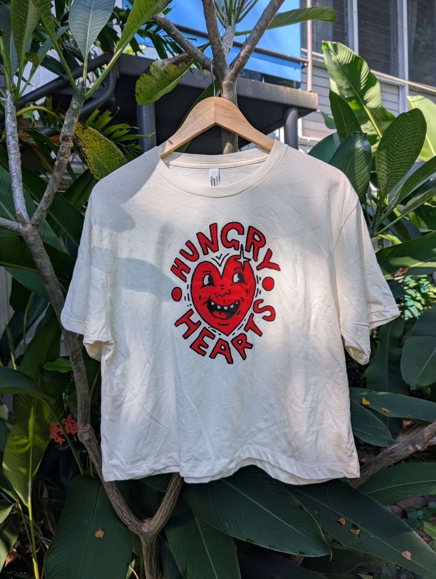 T-shirts are live! 

Logo by the stupidly talented and good-looking @dannycrouton . Lovingly hand screen printed in the driveway.

Please enjoy these photos of unironed shirts in the frangipani while a three-year-old yelled at me.

&hearts;️ Box cut,