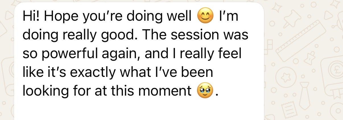 Screenshot of a text message with a positive message and smiley emojis.